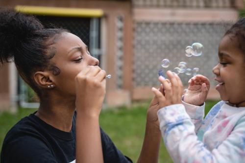 Blowing bubbles with Bri's Kids