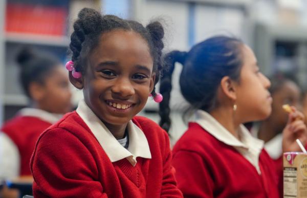 Young girl smiles at camera