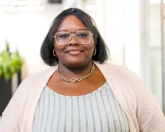 A young woman smiles for the camera