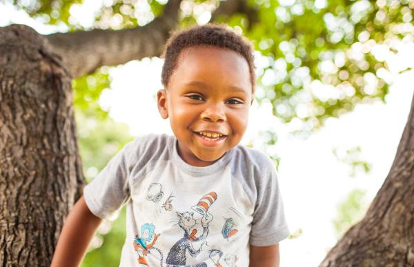 Boy playing in tree