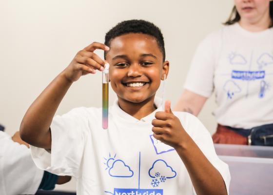 Child holding a test tube