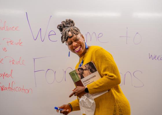 Woman standing in front of a whiteboard