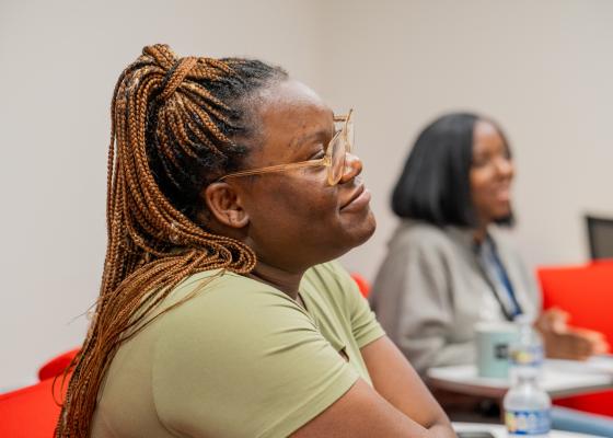 Two women learning in a classroom setting