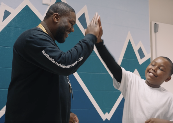Man and child high fiving