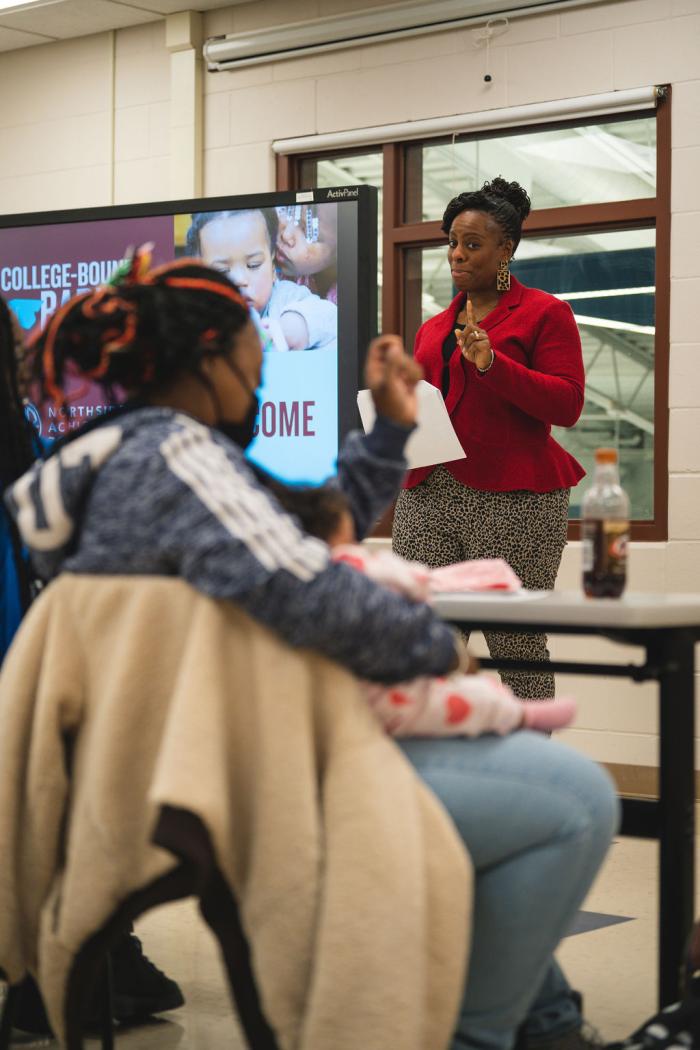 A facilitator leads a classroom.