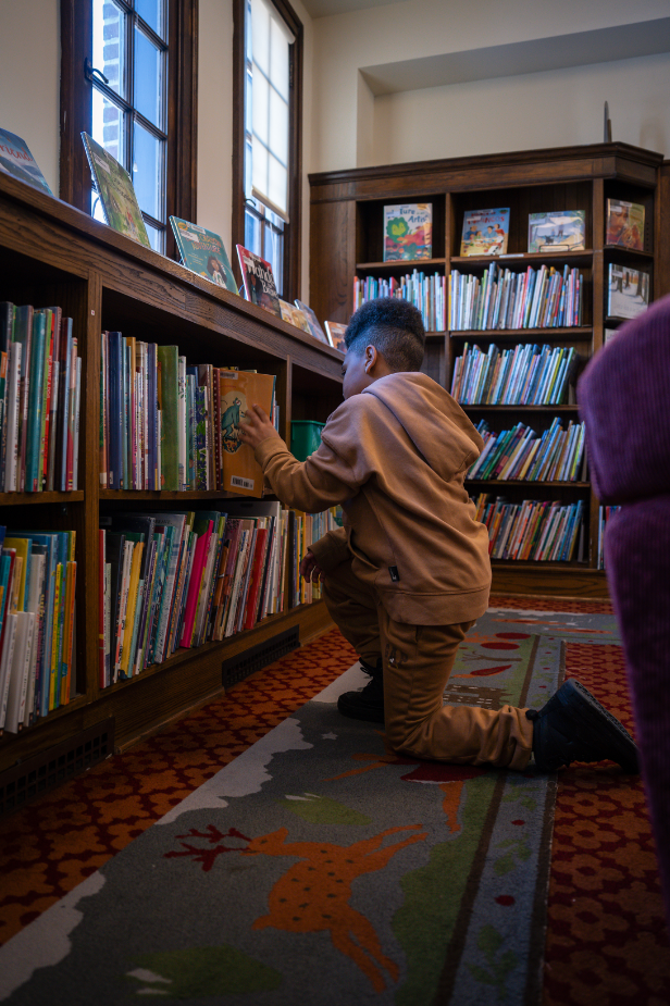 Shai in the library Shai by the bookshelf