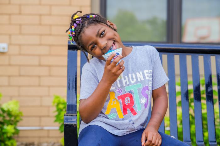 Girl eating snowcone