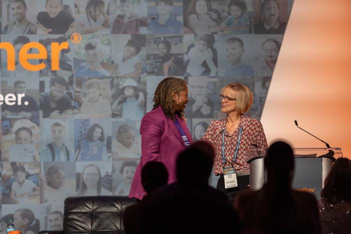 Two women accepting an award 