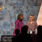 Two women accepting an award 